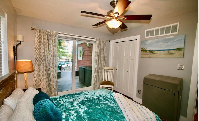 bedroom featuring ceiling fan, a closet, and access to exterior