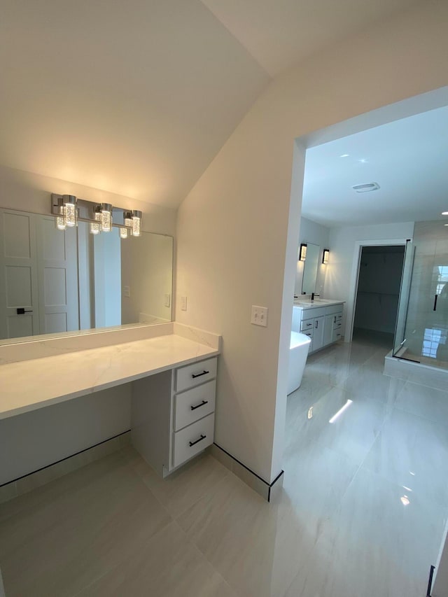 bathroom featuring vanity, shower with separate bathtub, and lofted ceiling