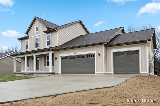 view of front of house featuring a garage and covered porch