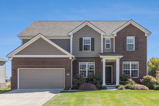 view of front of home featuring a garage and a front lawn