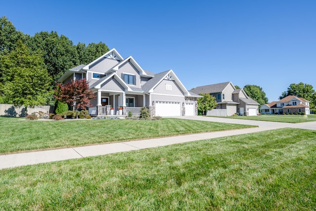 craftsman house featuring a front lawn and a porch