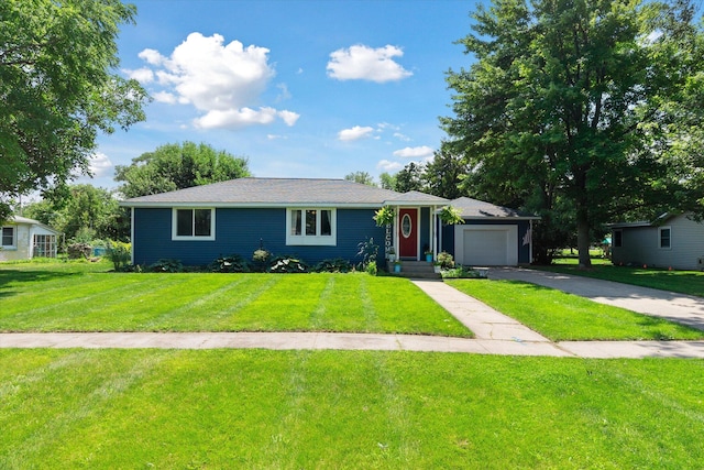 ranch-style house featuring a garage and a front lawn