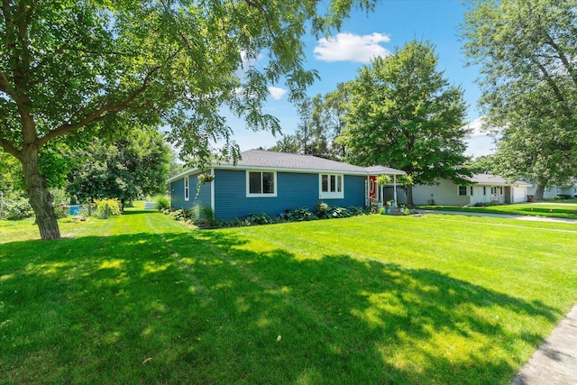 ranch-style home featuring a front lawn