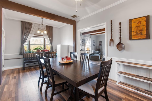 dining room featuring ceiling fan with notable chandelier, dark hardwood / wood-style flooring, and crown molding