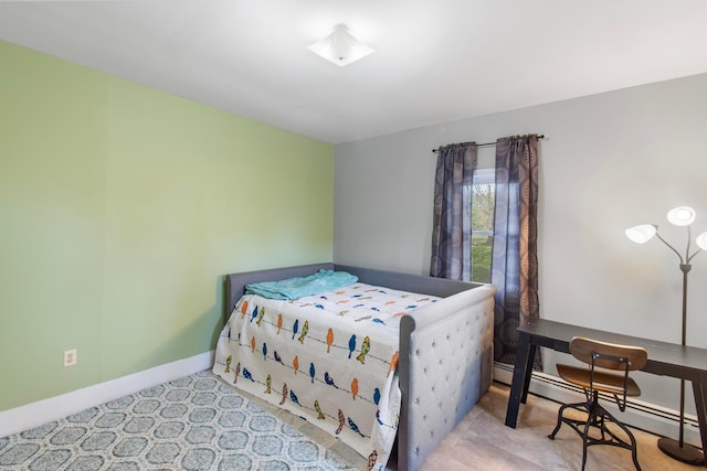 bedroom featuring light carpet and a baseboard radiator