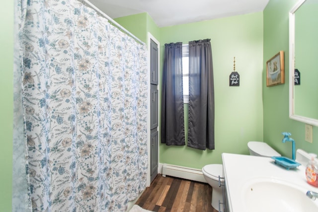 bathroom with vanity, a baseboard heating unit, toilet, curtained shower, and wood-type flooring