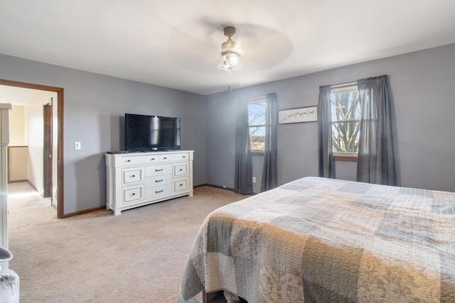 bedroom with light colored carpet and ceiling fan