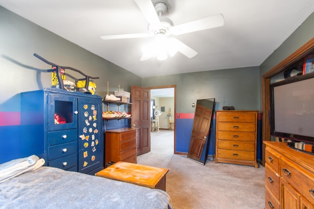 bedroom with ceiling fan and light carpet