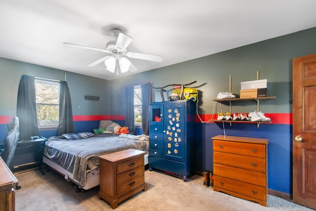 bedroom with light carpet and ceiling fan