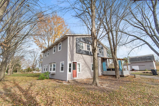 view of property exterior with a lawn