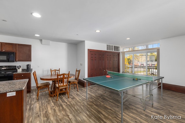 recreation room featuring dark wood-type flooring