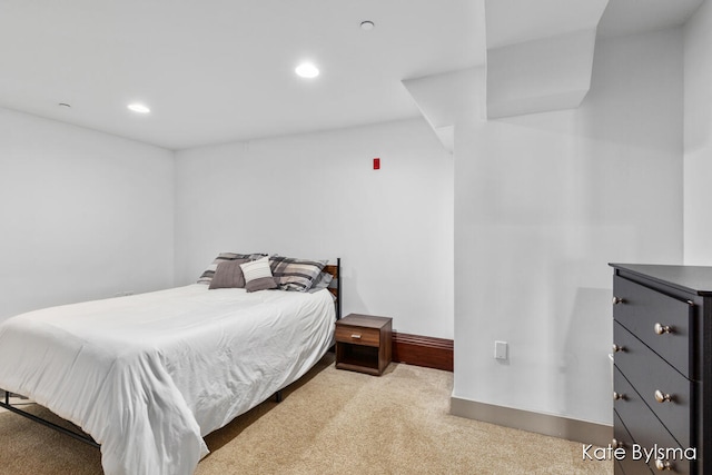 bedroom with light colored carpet