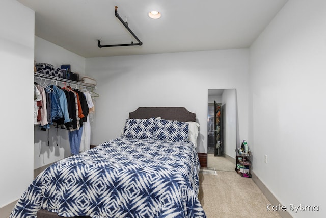 carpeted bedroom featuring a closet