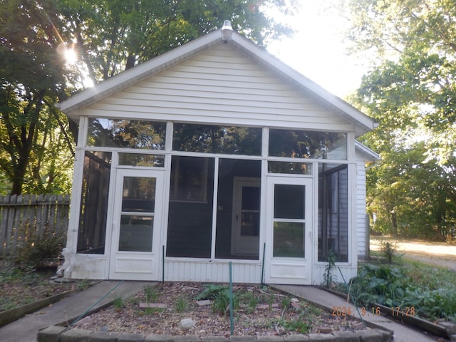 back of house with a sunroom