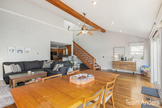 dining room featuring beam ceiling, ceiling fan, high vaulted ceiling, and light wood-type flooring