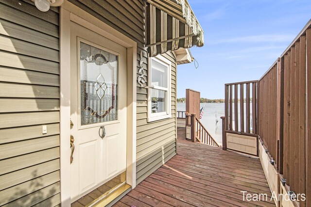 entrance to property with a water view