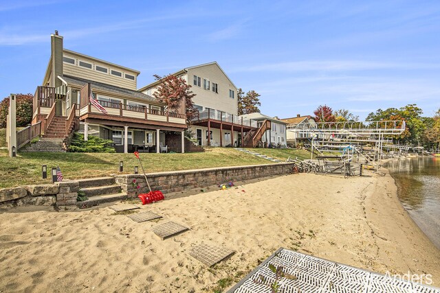 rear view of house with a wooden deck