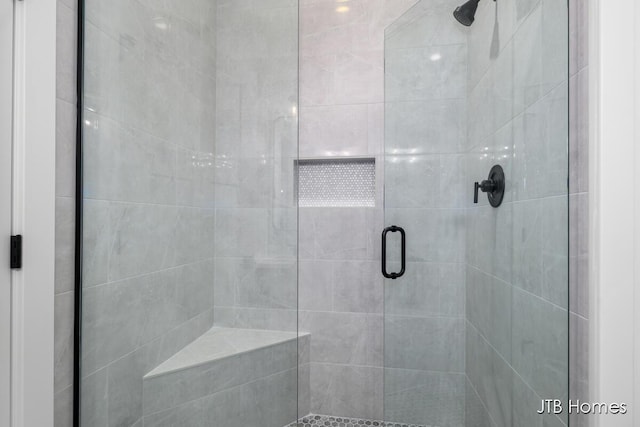 bathroom featuring an enclosed shower