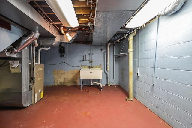 basement with sink and heating unit