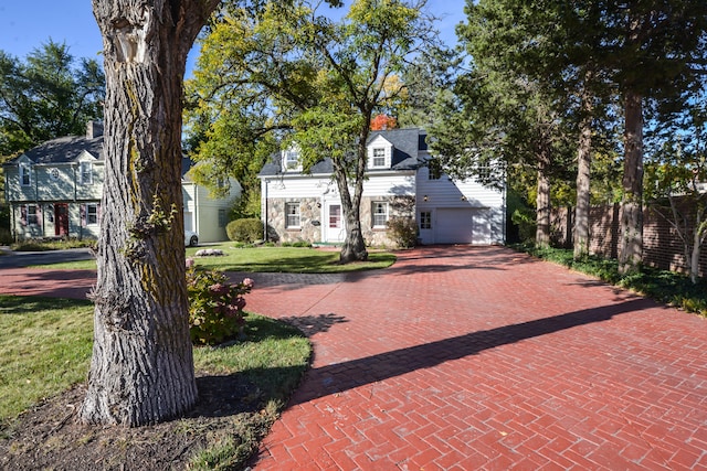 view of front of house with a front yard and a garage