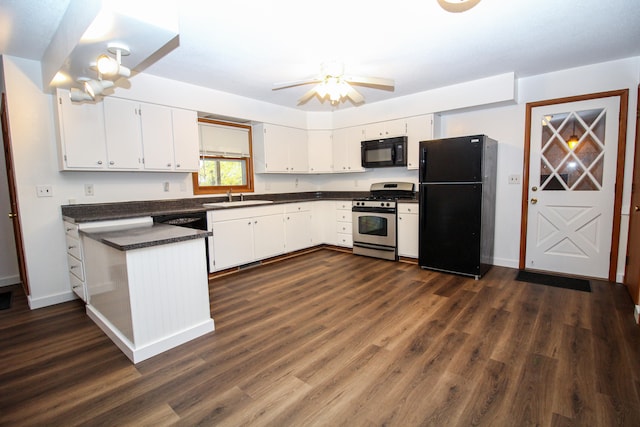 kitchen with dark countertops, white cabinets, and black appliances