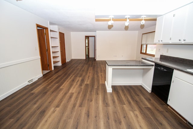 kitchen with a peninsula, visible vents, white cabinets, dishwasher, and dark countertops