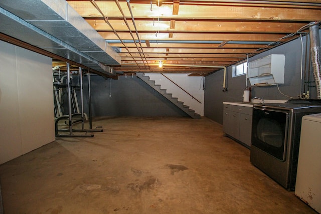 below grade area featuring washer and dryer and stairway