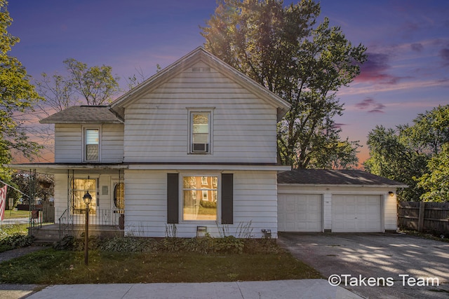 view of front of home featuring covered porch and a garage