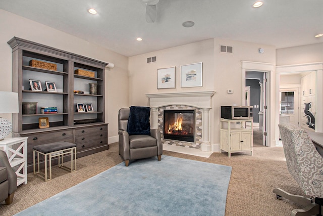 interior space featuring light carpet and a premium fireplace