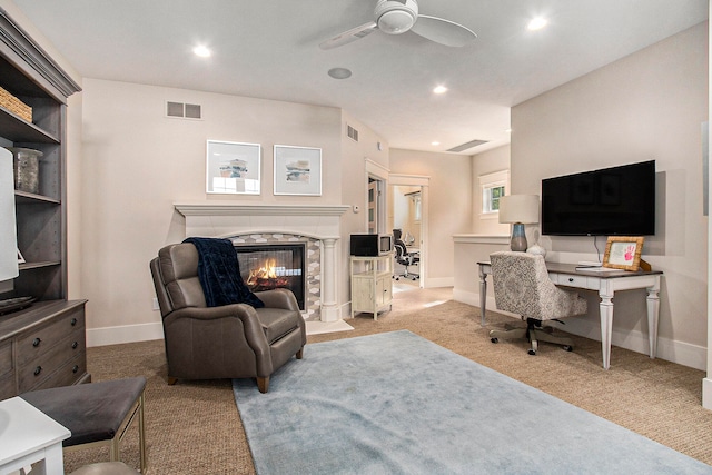 home office featuring ceiling fan and light colored carpet