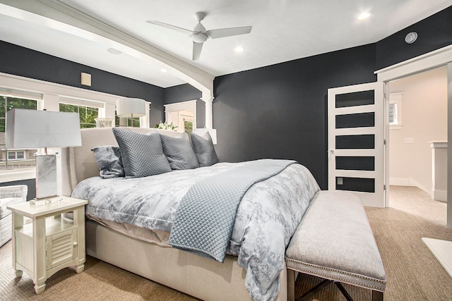 bedroom with light carpet and ceiling fan