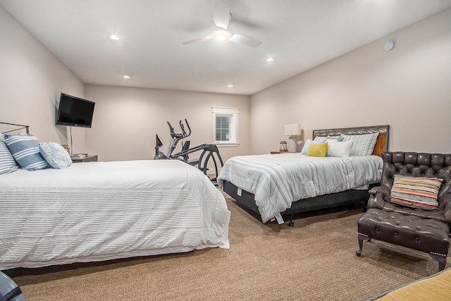 bedroom with ceiling fan and light colored carpet