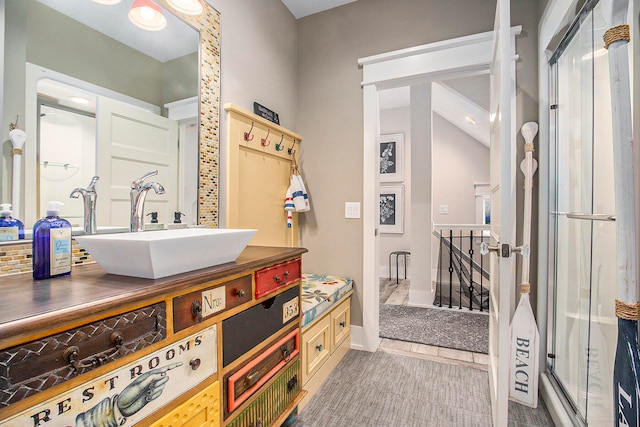 bathroom featuring vanity, tile patterned floors, and an enclosed shower