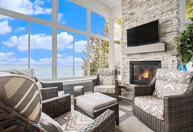 sunroom / solarium with a fireplace