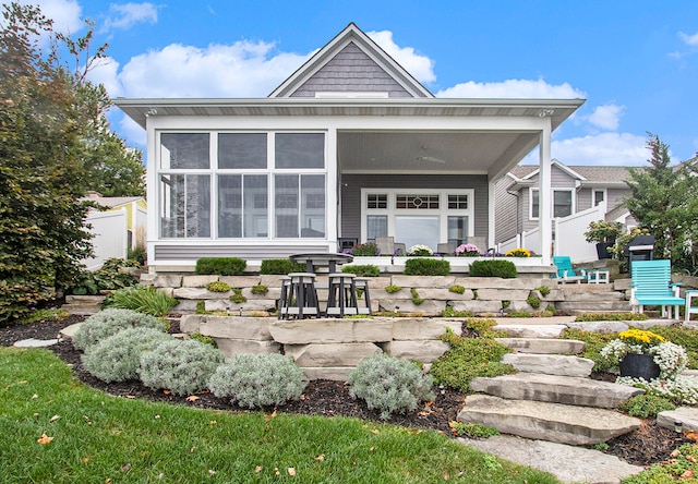 back of house featuring a sunroom