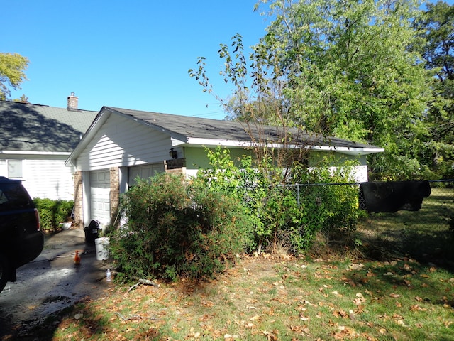 view of home's exterior with a garage