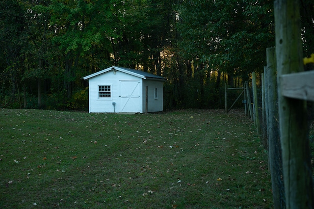 view of outbuilding featuring a yard