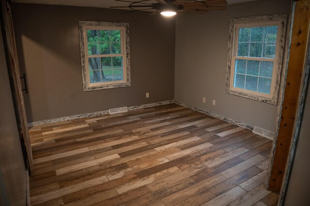 spare room featuring ceiling fan and hardwood / wood-style flooring