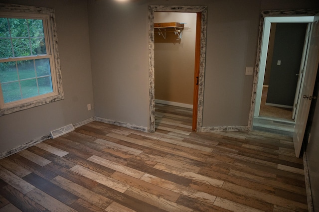 empty room featuring hardwood / wood-style flooring