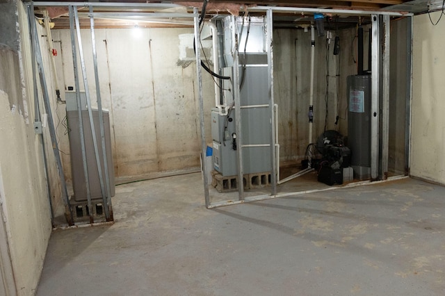 basement featuring water heater and heating unit