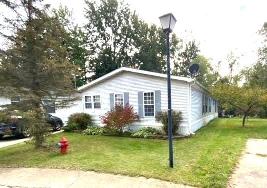 view of home's exterior with a lawn