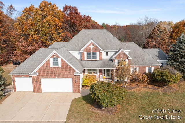 view of front property with a front yard and a garage