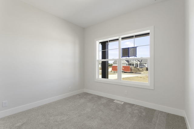 empty room featuring carpet floors