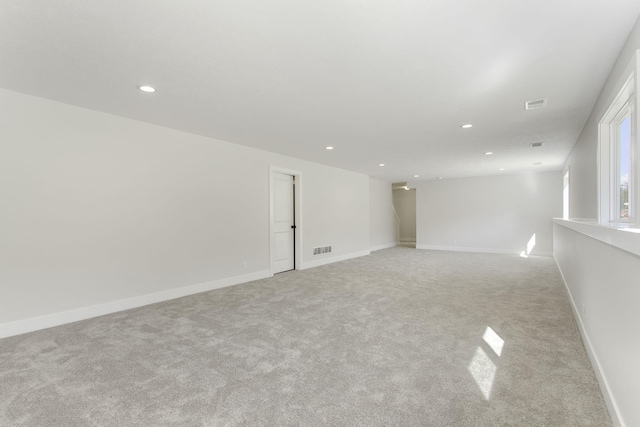 empty room with light colored carpet