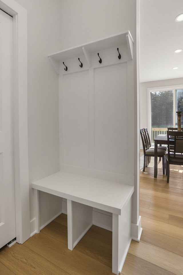 9530 Shoreway Dr, West Olive, MI 49460 - mudroom with wood finished floors, recessed lighting, and baseboards