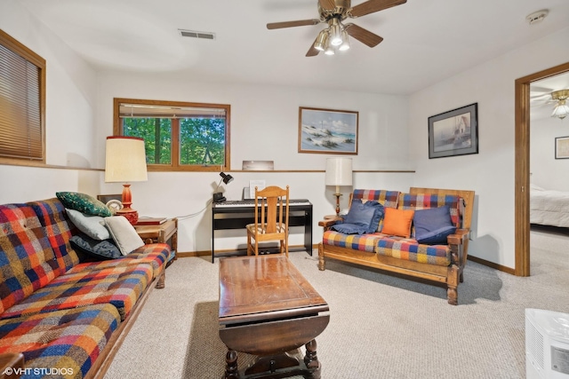 living room with carpet flooring and ceiling fan