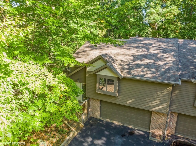 view of side of property with a garage