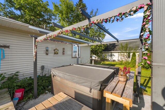 exterior space with a hot tub