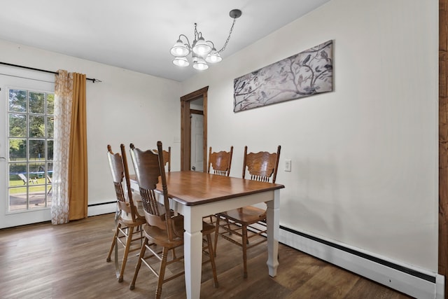 dining area featuring a notable chandelier, hardwood / wood-style flooring, and a baseboard radiator