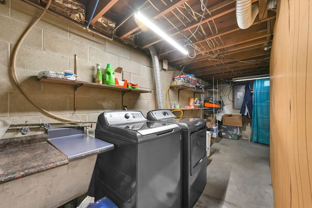 washroom with separate washer and dryer and sink